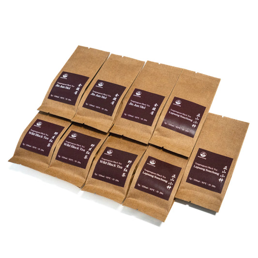 Brown tea packages with labels on a white background