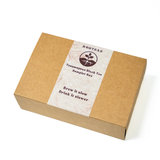Rooteas black tea sampler box with a label on a white background